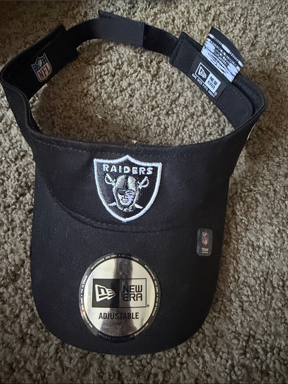 New Era Black Raiders Visor with Embroidered Shield